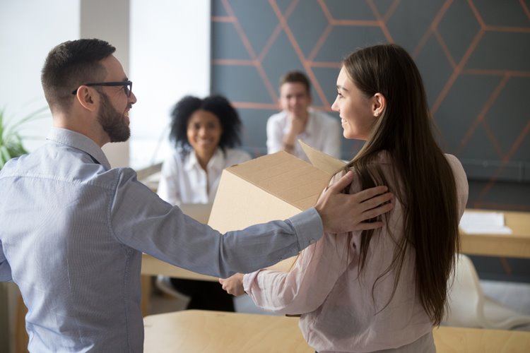 male boss welcoming woman employee