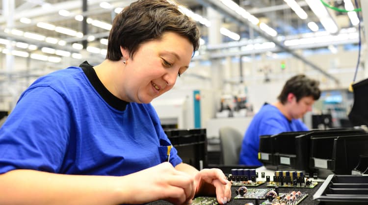 older woman working in factory