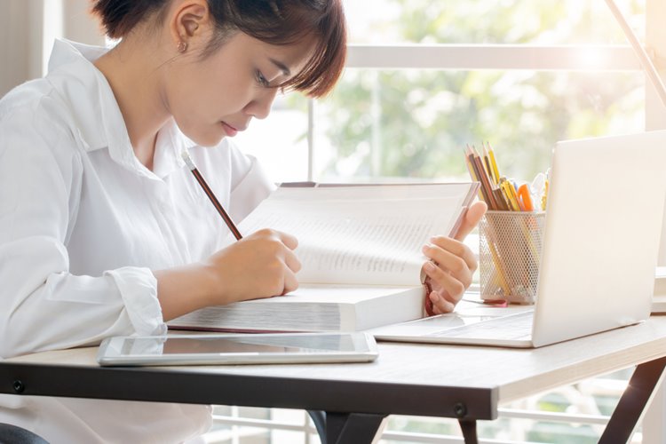 young asian woman studying