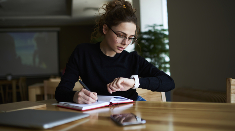 woman looking at watch