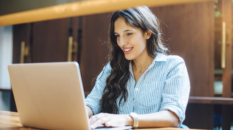 young woman studying at library