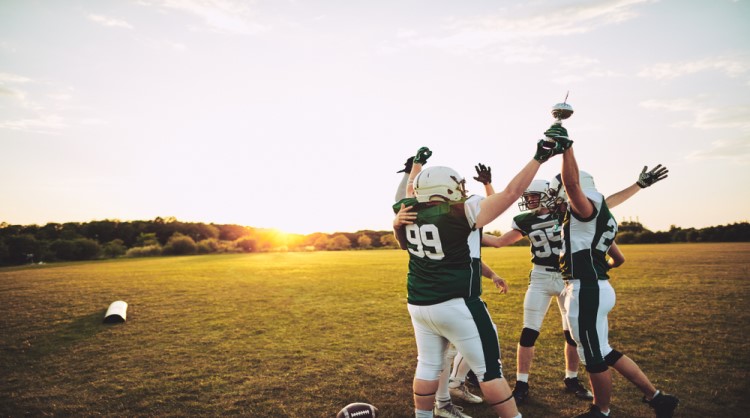 american football team cheering