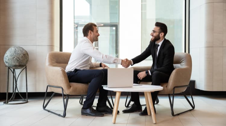 two men shaking hands