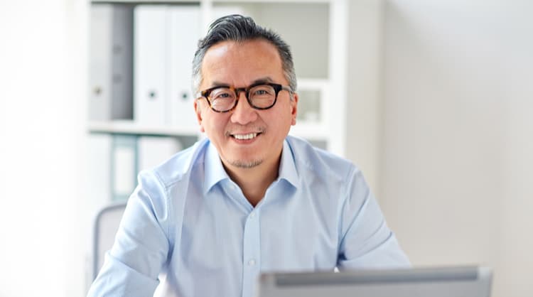 middle aged man smiling at camera