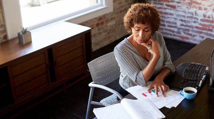 woman working alone and contemplating