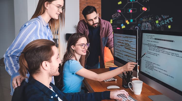 team of young programmers at work