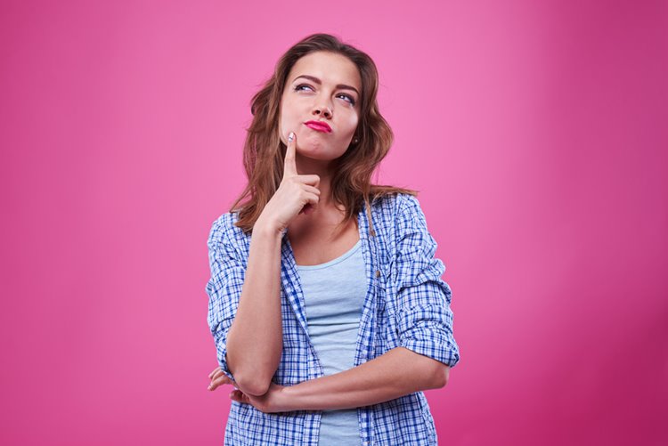 young woman with thinking face