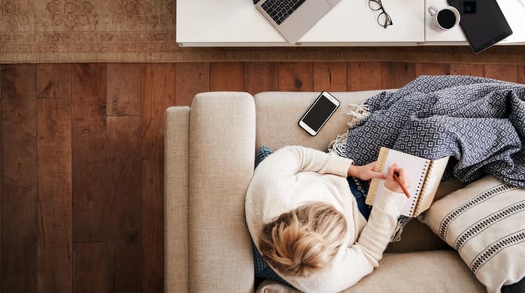 woman working from home on couch