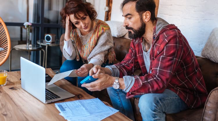 mature couple stressing over finances