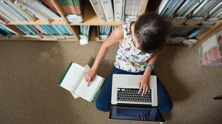 high school student studying at the library