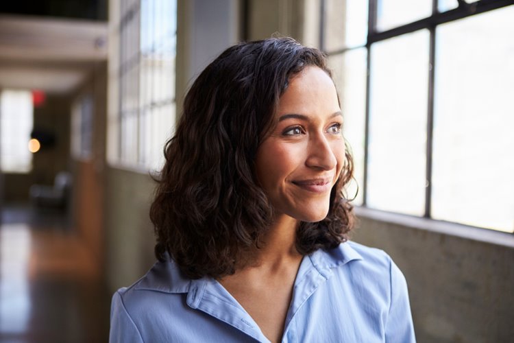 smiling woman look at window