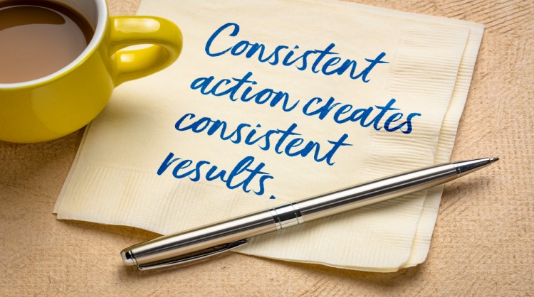 quote about consistency printed on napkin