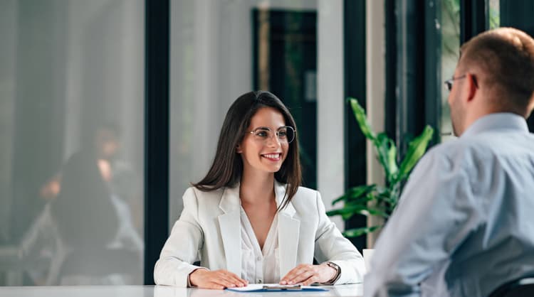 woman interviewing male job applicant