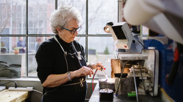 senior woman working at jewellery shop