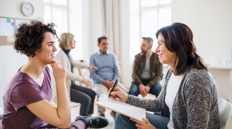 young woman meeting with counsellor