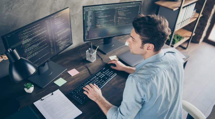 young man working with code