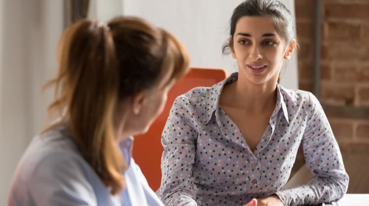 woman employee speaking with boss