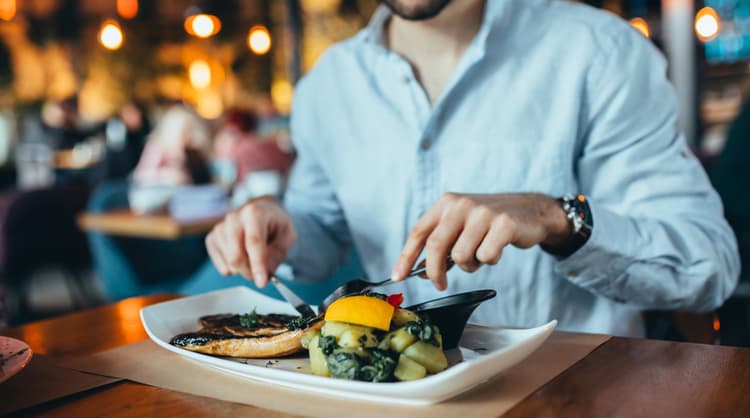 man having lunch at restaurant