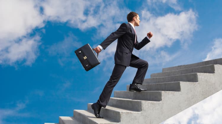 business man climbing stairs