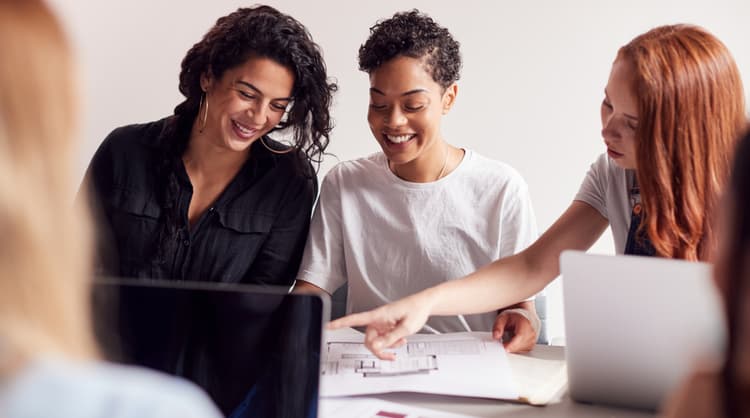 women happily working together