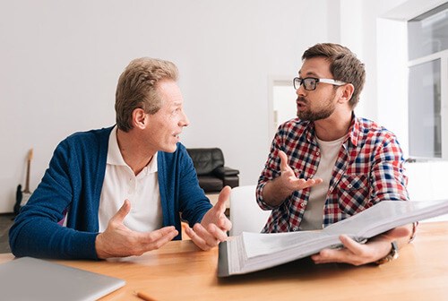 male colleagues having intense discussion