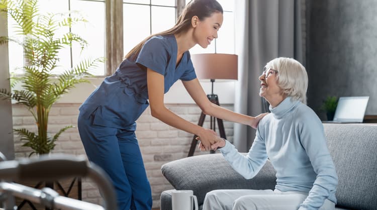 woman caregiver smiling at client