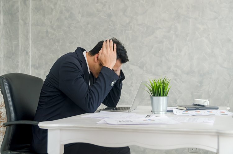 guy struggling at work