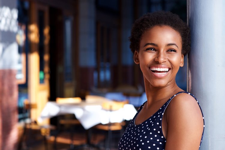 dark-skinned woman smiling