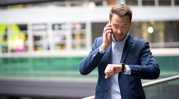 man looking at watch