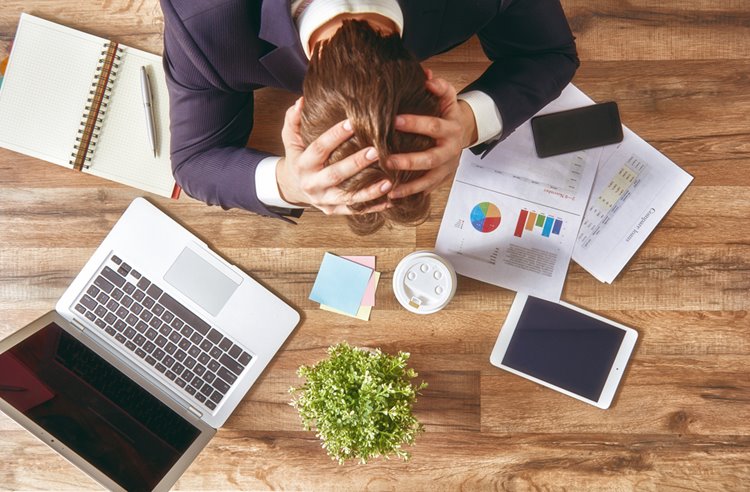 business man stressed out looking at work