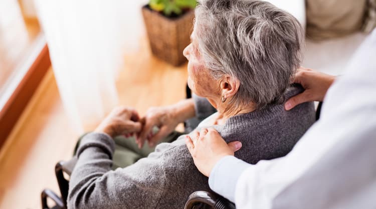 elderly woman sitting on wheelchair