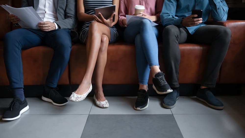 young people waiting outside for job interview