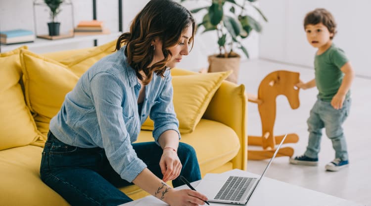 mother working from home with toddler