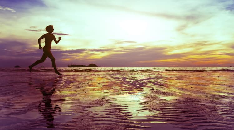 woman running barefoot