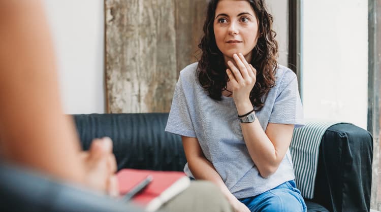 woman listening to therapist