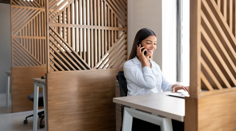 woman talking on the phone smiling