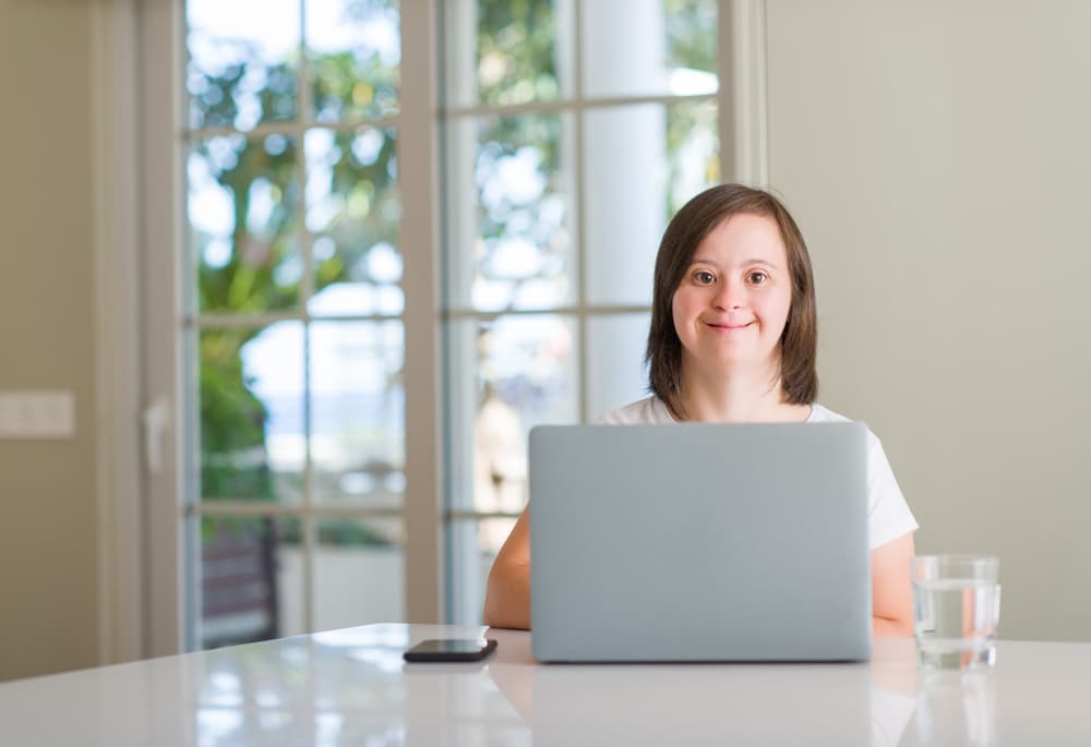 woman with down syndrome working from home