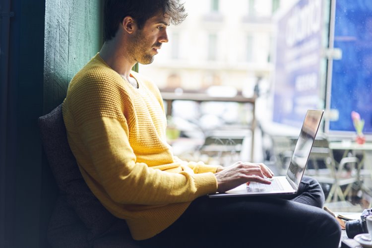 man working on his laptop