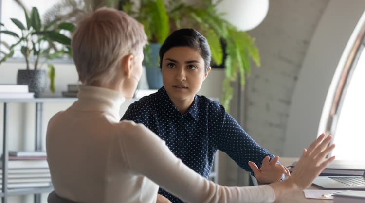 two women discussing