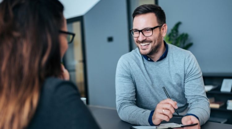 man smiling during interview