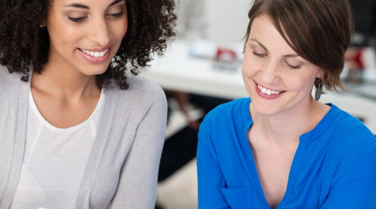 woman colleagues working with each other