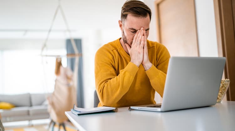 man feeling frustrated at work