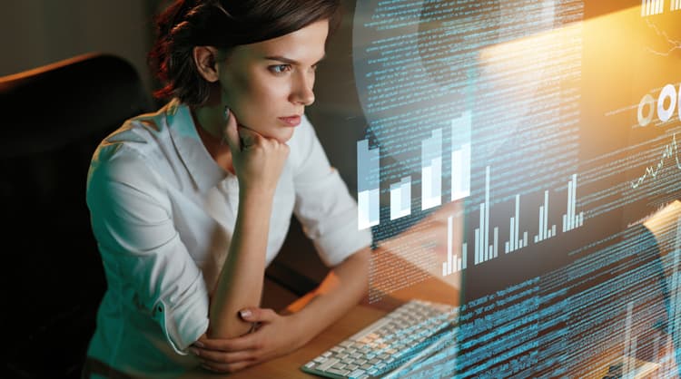 woman looking at data on screen