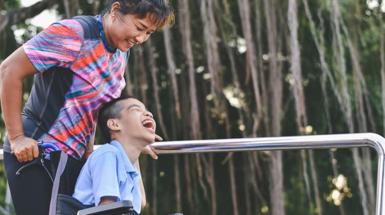 woman with child in wheelchair