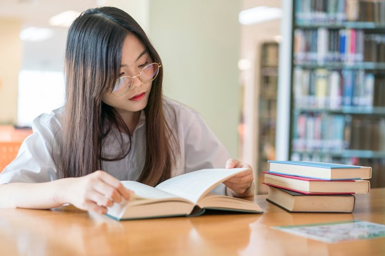 young asian woman studying