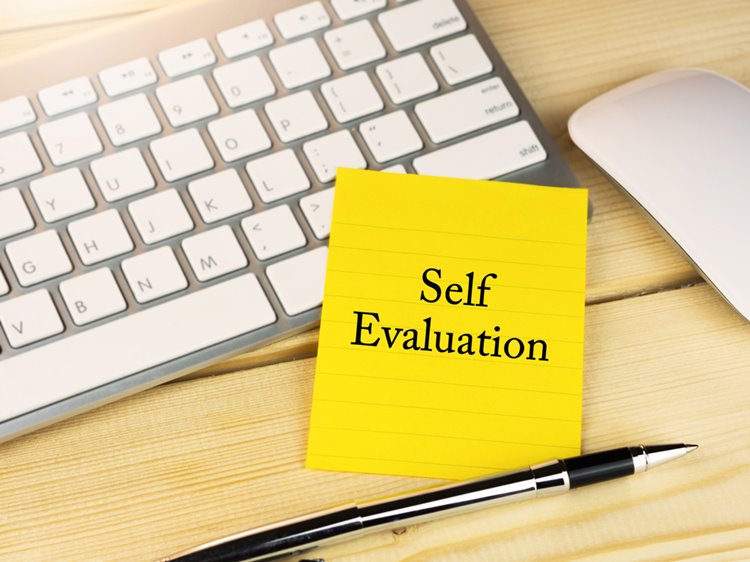 self evaluation typed on yellow sticky note