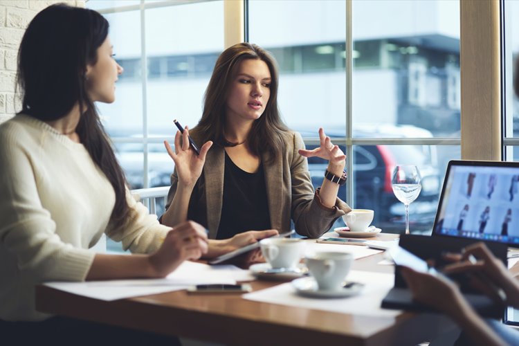 two women thinking strategically