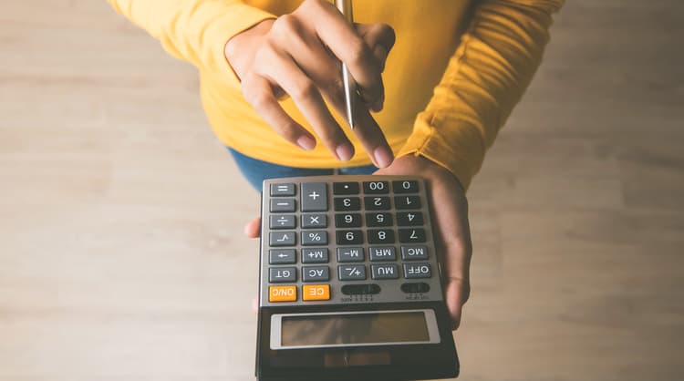 woman using calculator