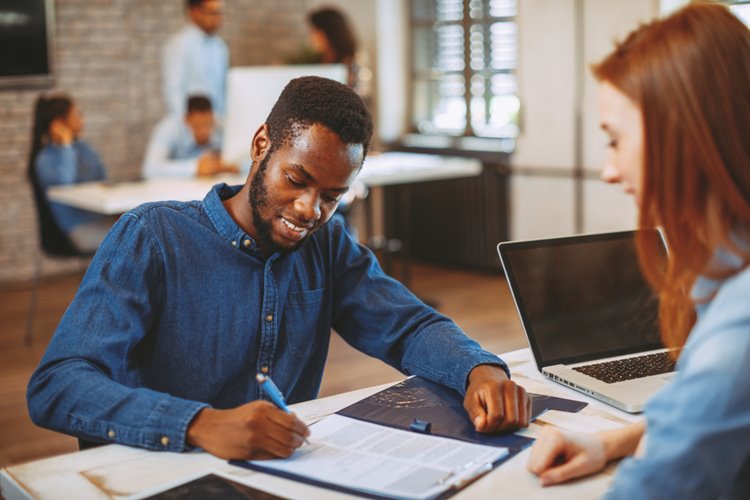 dark-skinned young man in job interview