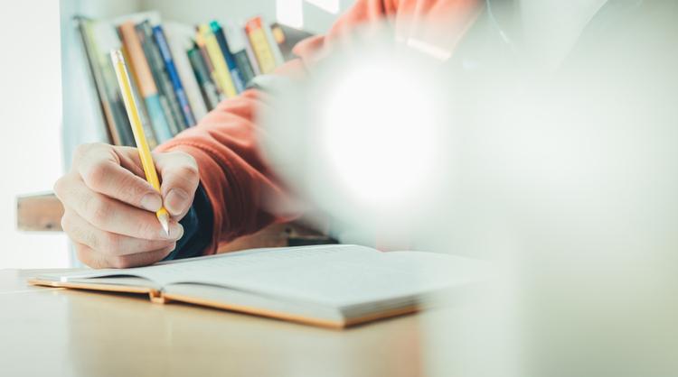 student studying in library